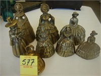 Eight 7 brass figural lady bells along with