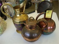 Two copper pitchers along with a 10" copper and