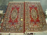 Pair of floral wool rugs, 26” x 50"