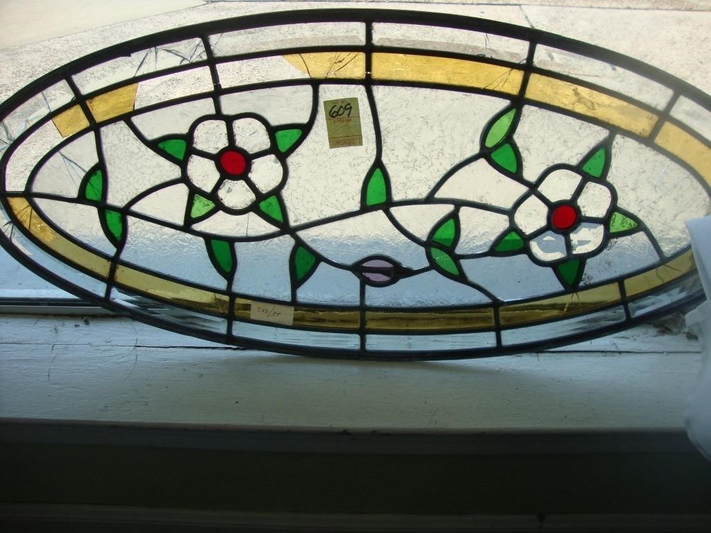 Large oval floral leaded glass window, 16” x 36”,