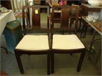 Pair of oak dining chairs with slip seats.