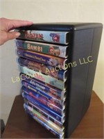 assorted Disney VHS tapes in holder rack