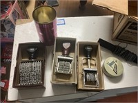 box of used stamps, hand stamp machines, date,