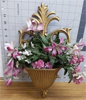 Wall sconce with floral arrangement