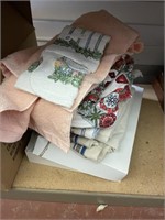 lot of dishcloths, towels, and large linen clothes