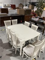 White Extendable table w/ 8 Chairs
Moderately