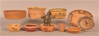 Lot of Native American Baskets and a Leather Doll.