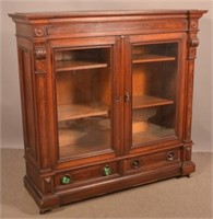 Victorian Walnut Carved and Molded Bookcase.