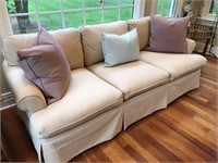Modern three cushion sofa with pillows