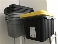 Five plastic storage tubs