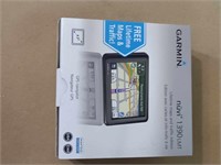GARMIN NUVI 1390 GPS PLUGGED IN AND DOES POWER ON