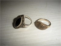 (2) Sterling Silver Rings  7 grams  size 4 & 8