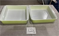 Two lime green Pyrex cake pans