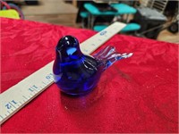 Glass bird part of back feathers broke