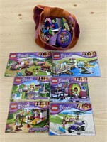 Assorted Lego pieces and booklets