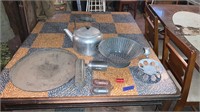 Colander, cast iron pan, tea kettle