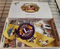 CIGAR BOX OF ASSORTED PINS BADGES AND PATCHES