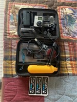 GO PRO CAMERA WITH BATTERIES AND CASE.