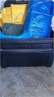 Tarps and bag of pegs in Action Packer Rubbermaid