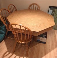 Approx. 52 in octagonal wooden table and chairs