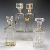 FOUR GLASS DECANTERS