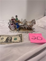 Horse drawn carriage figurine