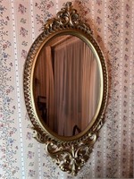 Vintage gold tone oval mirror