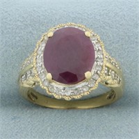 Ruby and Diamond Halo Ring in 14k Yellow Gold