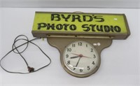 Byrd's photo studio lighted clock. Measures: 17"