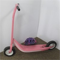 Little girl's scooter with helmet.
