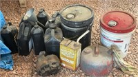 Multiple buckets of motor oil, transmission oil