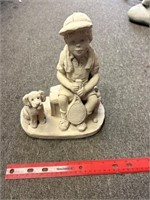 Small boy and dog tennis statue
