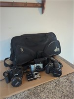 Collection of digital cameras and bag