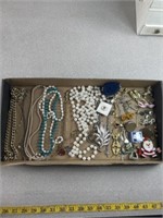 Jewelry including necklaces, bracelets, pins, and