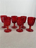 Ruby red daisy button glass stem wine goblets.