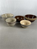 Small pottery mixing bowls. Largest is