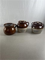 Stoneware crocks with lids. One marked Blue Crown
