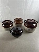 Stoneware crocks with lids. Largest is