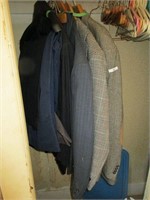 Lot of suit jackets and pants