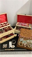 Vintage jewelry boxes with various pieces of