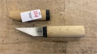 Knife in wood handle with oriental marks