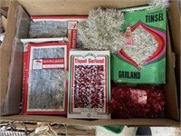 Vintage boxes of tinsel, garland