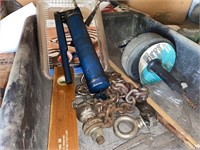 Drain cleaning snake, hitch ball, grease gun and