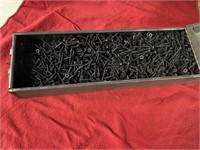 Large metal box of screws