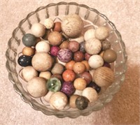 Bowl full of Vintage earthenware clay marbles