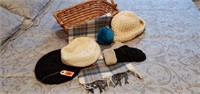 Basket of winter hats, gloves, earmuffs, scarf