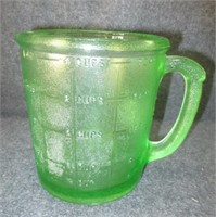 Vintage green measuring cup. Measures: 5.5" tall.