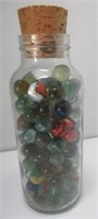 Jar with assorted marbles.