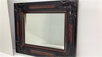 Beveled glass mirror in pretty wide molded frame,