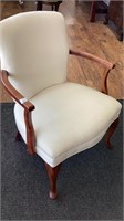 White upholstered armchair, wide seat, possibly
